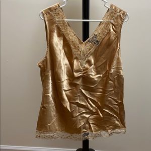 A gold sleeveless blouse